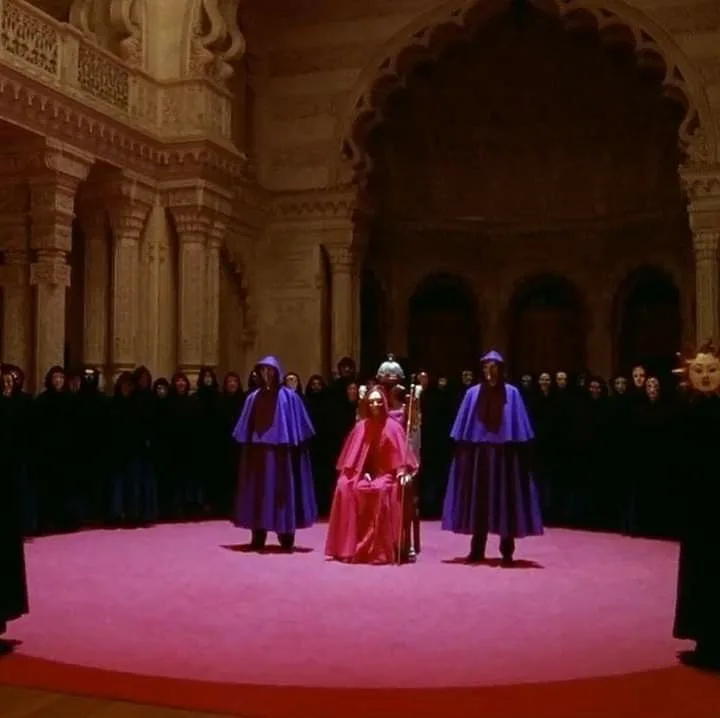 Robed figures in a ritual ceremony — Eyes Wide Shut