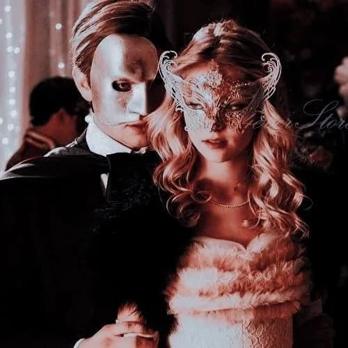 Masked couple in an intimate embrace